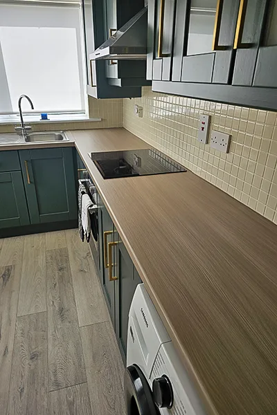 Kitchen countertops elegantly revamped with premium vinyl wrap, displaying a seamless finish and intricate design, expertly installed by Iconic Kitchen Wraps, Dublin's top vinyl wrapping service